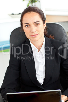 businesswoman sitting at her desk