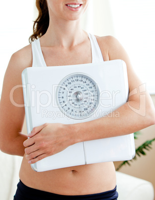 woman holding a scale