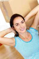 woman relaxing at the middle of boxes