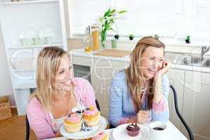 female friends eating pastries