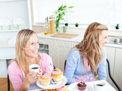 female friends eating pastries