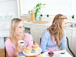 female friends eating pastries