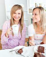 female friends eating a chocolate cake