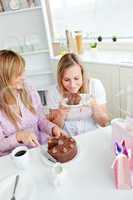 female friends eating a chocolate cake