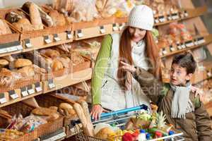 Grocery store shopping - Red hair woman with little boy