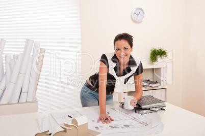 Smiling female architect at the office