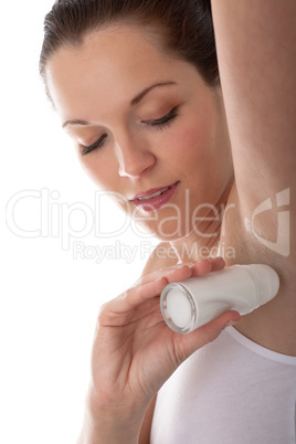 Body care series - Young woman applying deodorant