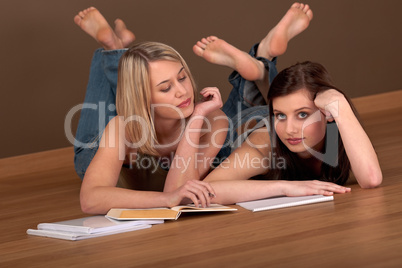 Student series - Two students lying on wooden floor