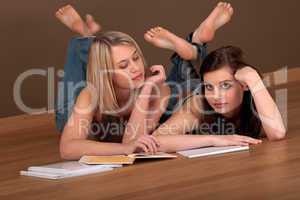 Student series - Two students lying on wooden floor