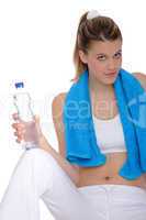 Fitness - Young sportive woman with water and towel