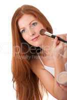 Body care series - Beautiful red hair woman applying powder