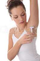 Body care series - Young woman shaving armpit