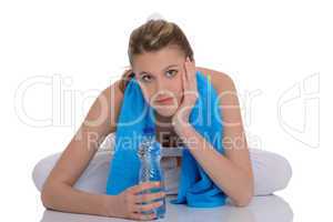 Fitness - Young sportive woman with water and towel