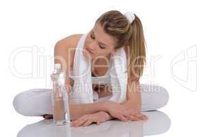 Fitness - Young sportive woman with water and towel