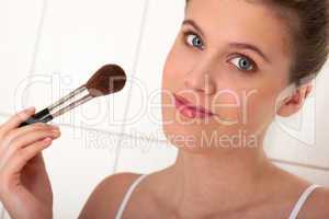 Body care - woman applying powder