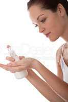 Body care series - Young woman with white bottle of lotion
