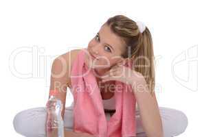 Fitness - Young sportive woman with water and towel