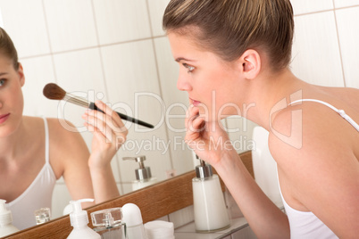 Body care series  - young woman doing make-up