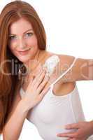 Body care series - Long red hair woman applying lotion