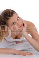 Fitness - young sportive woman on white