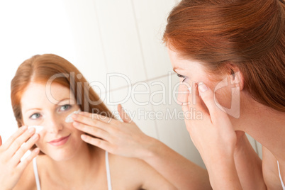 Body care series - Attractive young woman applying cream Body care series - Attractive young woman applying cream