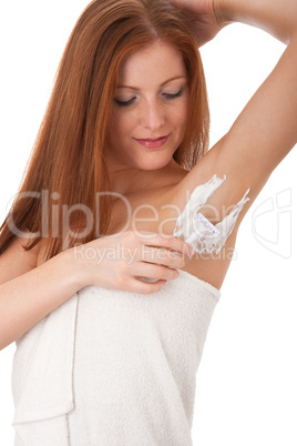 Body care series - Young woman shaving her armpit