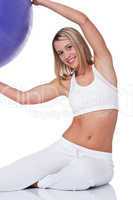 Fitness series - Young woman with purple ball