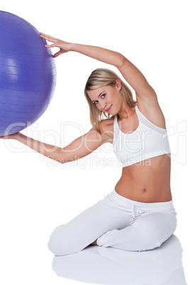 Fitness series - Young woman with purple ball