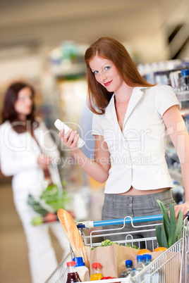 Shopping series - Red hair woman holding shampoo