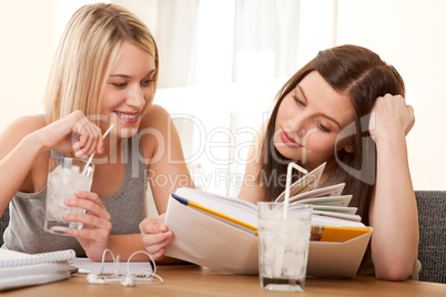 Student series - Two teenage girls reading together