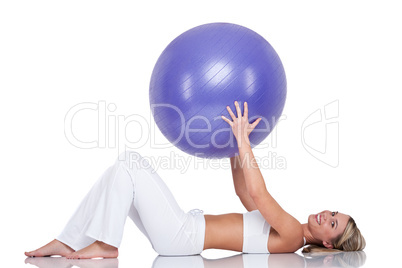 Fitness series - Young woman with purple ball