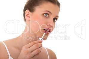 Body care series - woman applying lipstick