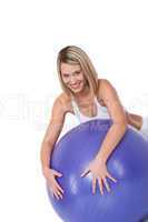 Fitness series - Young woman with purple ball