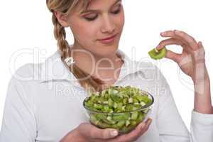 Healthy lifestyle series - Woman holding slice of kiwi
