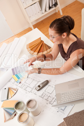 Female interior designer with color swatches