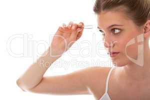 Body care series - Young woman using tweezers