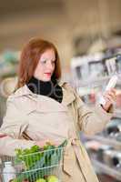 Shopping series - Red hair woman buying shampoo