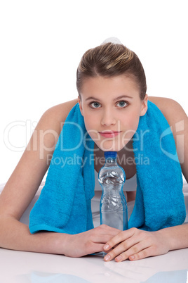 Fitness - Young sportive woman with water and towel