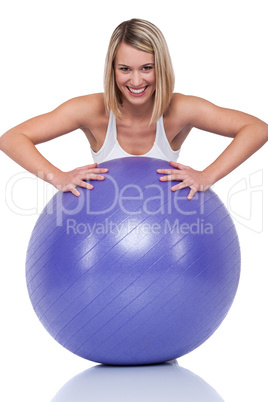 Fitness series - Blond smiling woman with purple ball