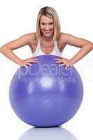 Fitness series - Blond smiling woman with purple ball
