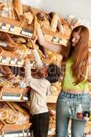 Grocery store shopping -  Red hair woman with child
