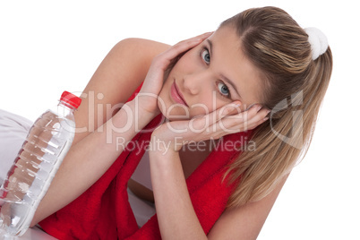 Fitness - Young sportive woman with water and towel