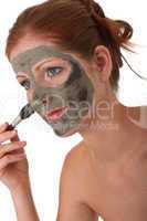 Body care series - Young woman with mud mask