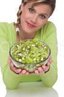 Healthy lifestyle series - Woman holding bowl of kiwi