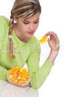 Healthy lifestyle series - Woman eating orange