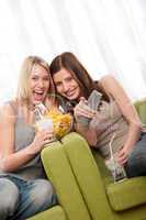Students series - Blond girl and brunette watchning television