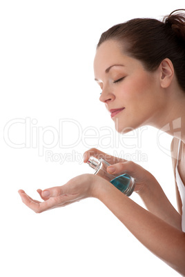 Body care series - Beautiful woman applying perfume