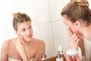 Body care series - woman applying moisturizer