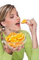 Healthy lifestyle series - Woman eating orange