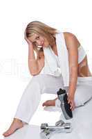 Fitness series - Attractive blond woman with weights and bottle
